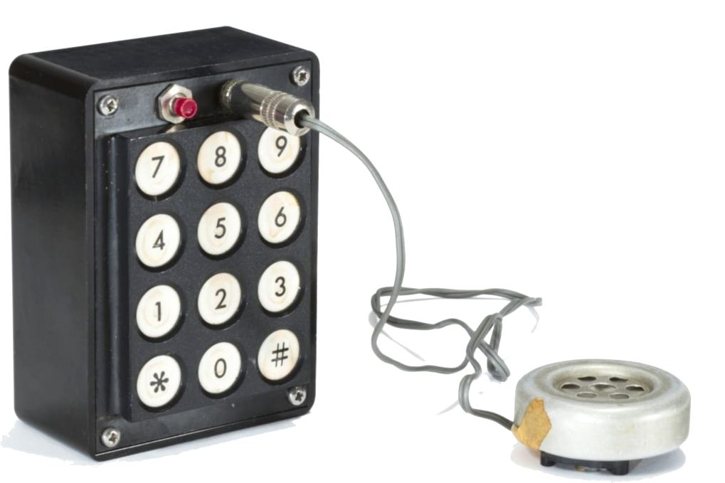 A blue box built by Steve Wozniak, circa 1972. Black rectangular device with telephone keypad and speaker.